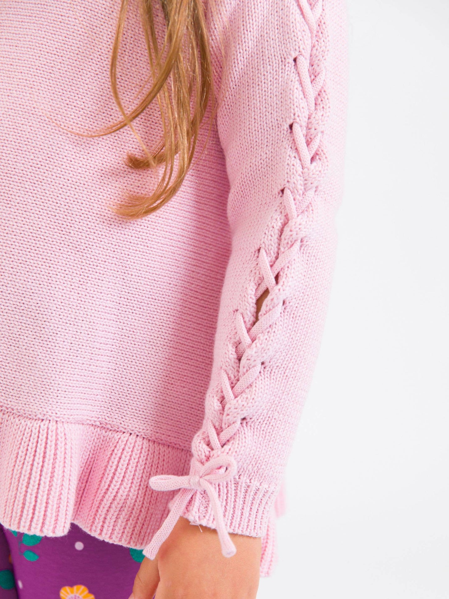 RuffleButts + RuggedButts - Girls Pink Ruffle Hem Lace Up Sweater
